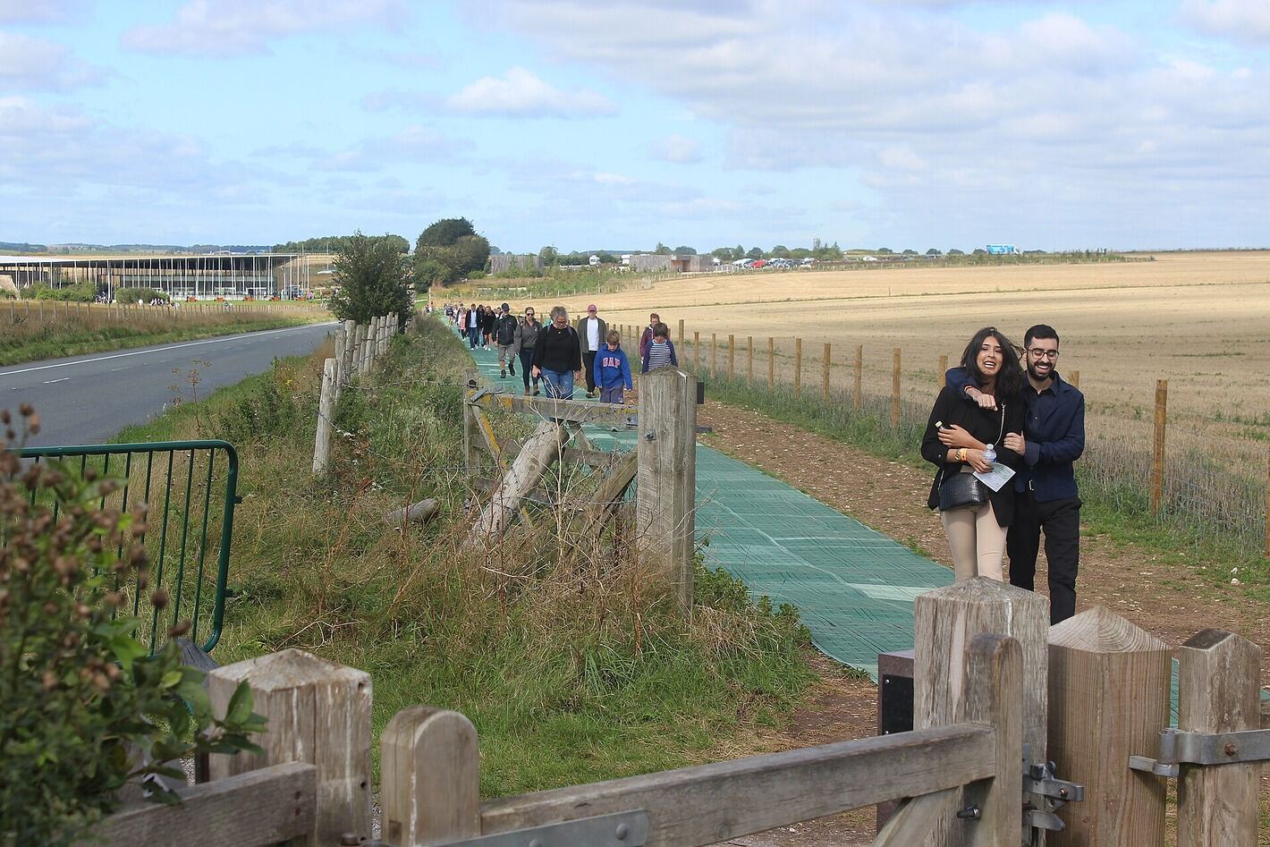 Visitors walking the path from the Stonehenge Visitor Centre to the stones